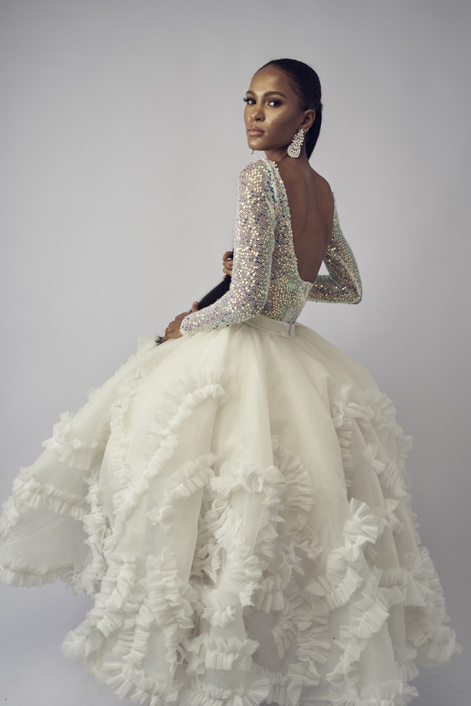 White gown with flared, ruffle skirt