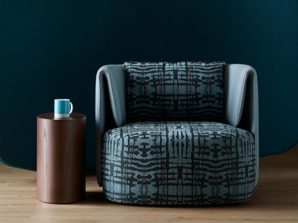 An armchair covered in the Ink upholstery textile from the Duality collection
