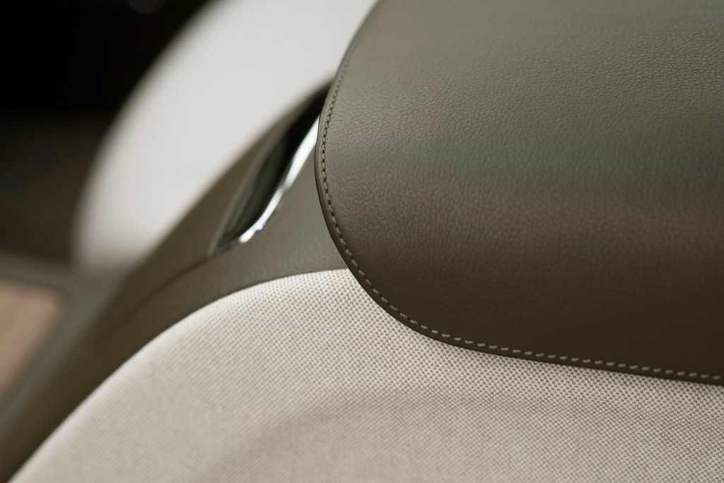 The interior of the car features Hermès Enea Green leather
