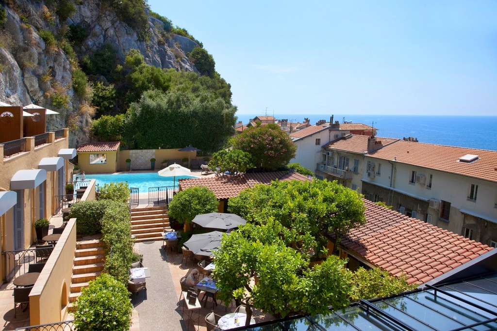 Terrace with restaurant and swimming pool at La Perouse Hotel in Nice UNESCO Heritage Site