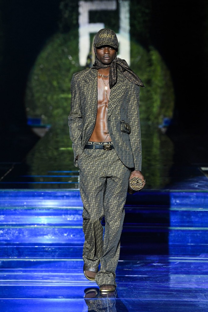 A male model wears a shirtless Fendi by Versace suit