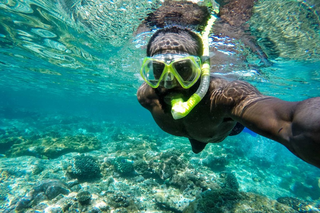 African american man snorkeling which is a great idea for edventure trips