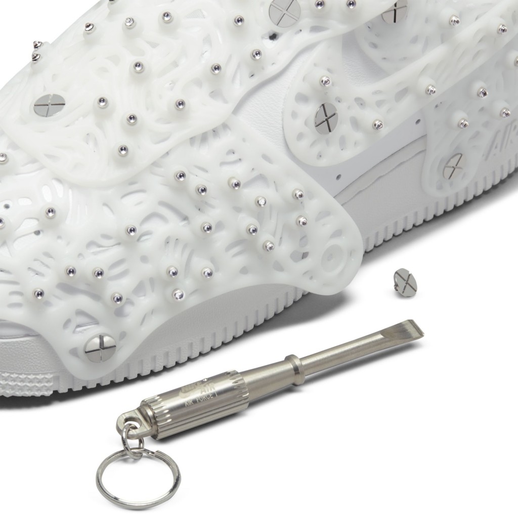 The matching Swarovski screwdriver beside the sneaker