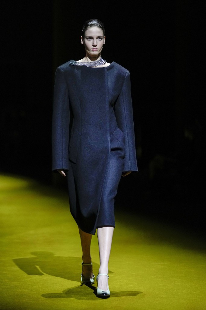 Another model strutting down the runway in a piece from the Prada Fall Winter 22 collection